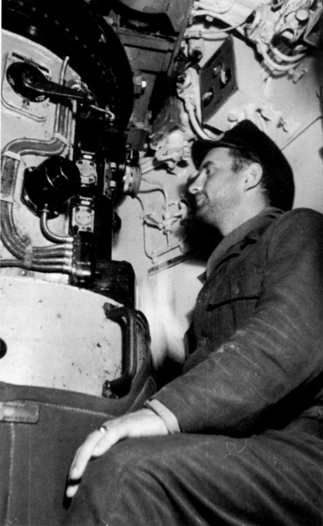 KrvKpt. Reinhard Suhren at the attack periscope in U 564's conning tower (the single azimuth circle is visible)